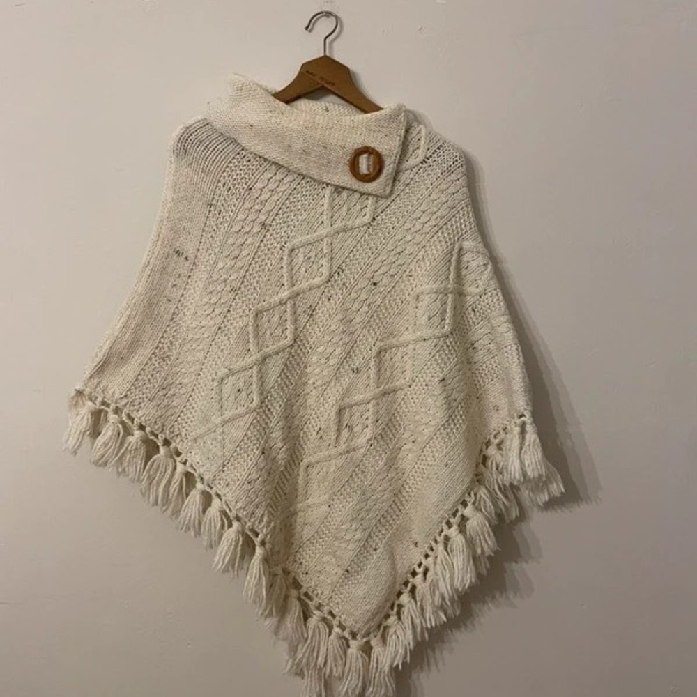 Elegant Cream Knit Poncho with Fringe